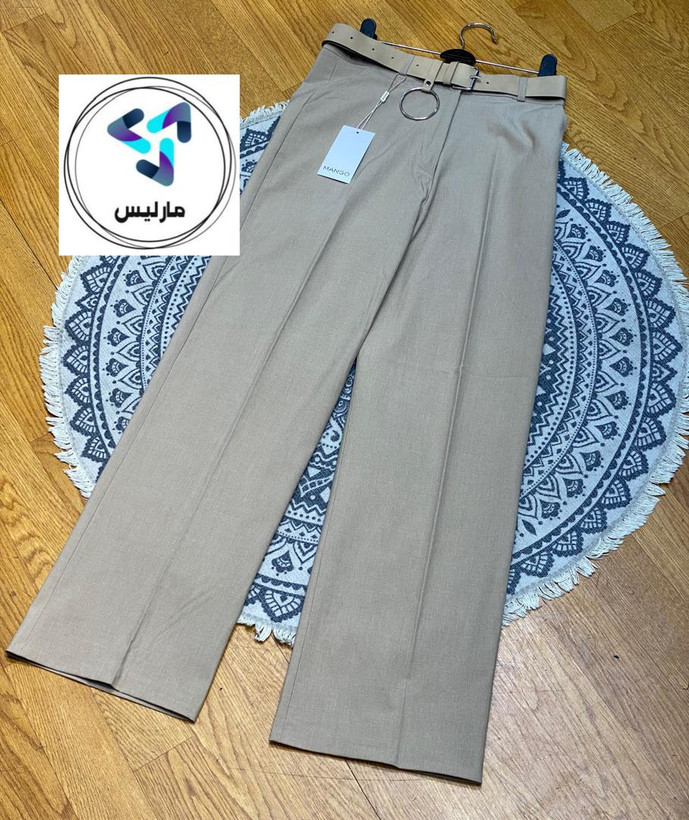 شلوار زنانه مارلیس نیم بگ طرح برند منگو پارچه بزایاق ترک با قد 105 سانتی متر