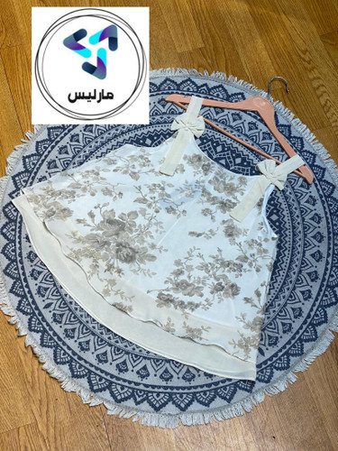 تاپ زنانه مارلیس پایین کلوش طرح دار پارچه الیزه وارداتی آستردار با قد 60 سانتی متر